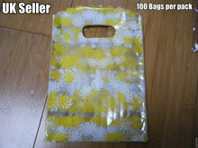 Load image into Gallery viewer, 100 x CLEAR PLASTIC YELLOW SWIRLS GIFT PARTY CARRIER BAGS SHOPS SWEETS 18cmx12cm
