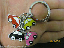 Load image into Gallery viewer, 4 PIECE ANIMATED CARS TRANSPORT ENAMEL KEYRING HANDBAG CHARM GIFT IDEA UK SELLER
